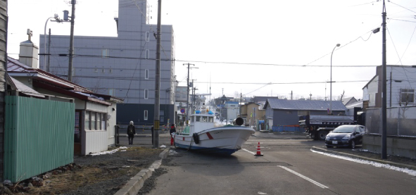 Fig. 1: Example of flood damage (grounded fishing boat in Yayoi town)