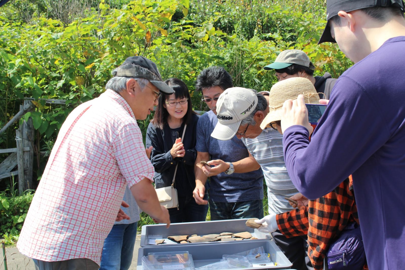 Professor Kato explaining archaeological finds to the local community.