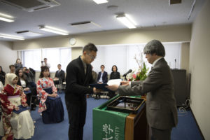 MJSP graduate Chao Ping Lai accepting his diploma