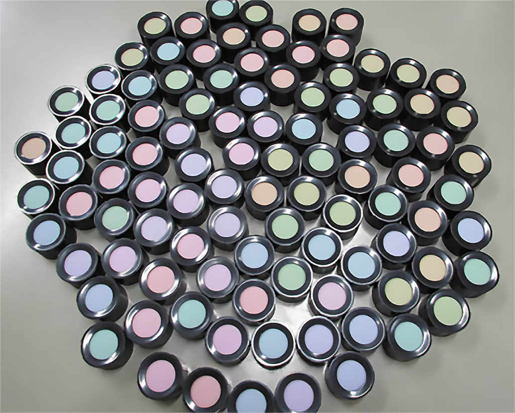 Participants are asked to arrange makeup pots by color gradient.