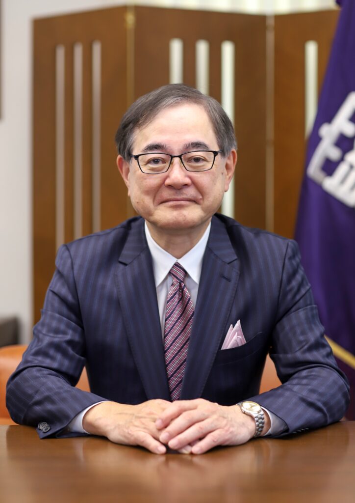 President Kiyohiro Houkin is sitting facing towards the camera.