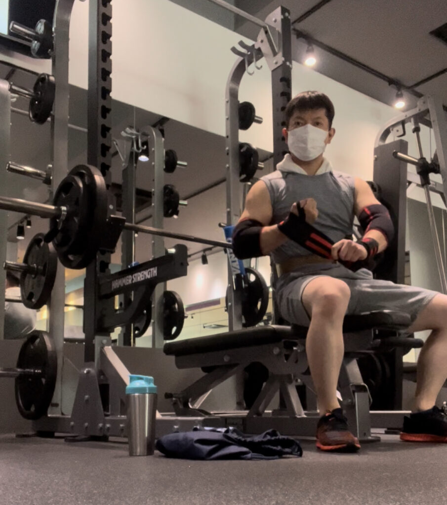 Associate Professor Teppei J. Yasunari at a strength-training machine in the gym.