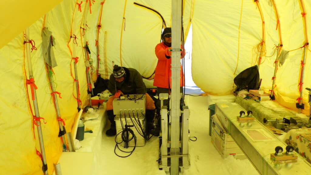 Sumito Matoba (left) and Yoshinori Iizuka (right) on the southeastern dome in Greenland, drilling the ice core used in the study. Photo by Sumito Matoba.